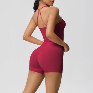 Detail of burgundy yoga bodysuit showing slim fit and cross-back strappy design