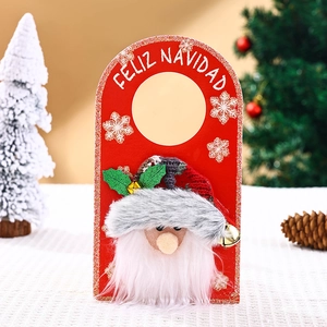 Detail of Christmas Santa door hanger with plush beard, wood panel and metal bell
