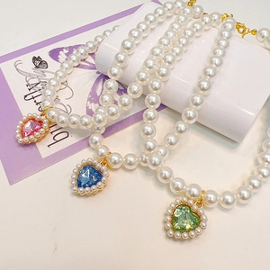 Elegant pearl pet necklace with heart-shaped crystal pendants in pink, blue, and green