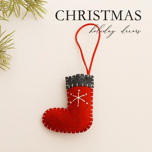 Handmade red wool felt Christmas stocking ornament with white snowflake embroidery