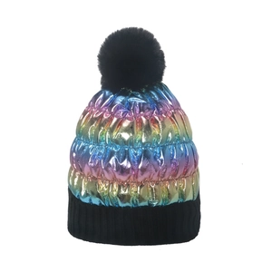 Rainbow gradient metallic winter knit hat with black faux fur pompom and ribbed cuff