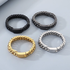 Flat lay of Cuban link bracelets in gold, silver, black and gunmetal finishes