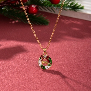 Christmas wreath pendant necklace with red bow and crystal on a festive red background