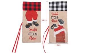 Detail of burlap Christmas wine bottle bags with Santa Claus patterns and lattice design