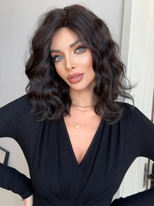 Close-up of black medium-length wavy synthetic wig showing natural texture and volume