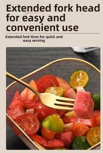 Close-up of golden stainless steel dessert fork with long tines for fruit and cake
