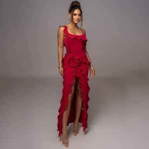 Detail of red floor-length dress with ruffle trim, high slit, and waist flower decoration