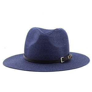 Detail of dark blue straw fedora featuring a black leather band and gold buckle