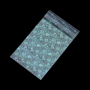 Macro shot of laser iridescent self-sealing OPP bags with cherry blossom patterns