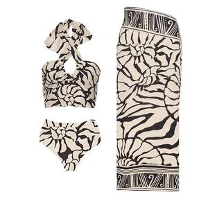 Detailed flat lay of a 3-piece printed swimwear set with halter top, bottom and sarong