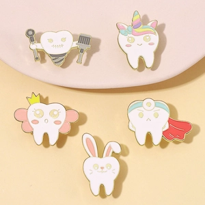 Set of five cute cartoon tooth enamel pins with wings and crowns on pink background