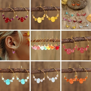 Bohemian style hoop earrings with natural multi-color stone beads on gold-tone frames