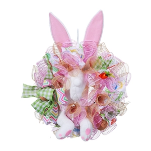 Detail of Easter bunny butt wreath with plush ears, ribbons, and decorative carrots