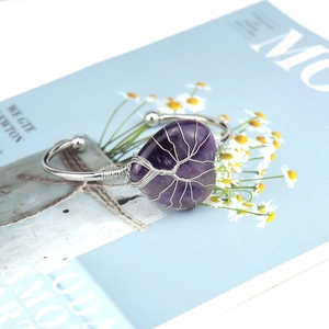 Detail of silver tree of life wire-wrapped purple heart crystal open cuff bracelet