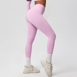 Close-up of pink high-waisted yoga pants with brushed fabric for a seamless fitness look