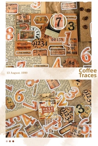 Close-up of vintage coffee-themed journal stickers with gold stamping on antique paper
