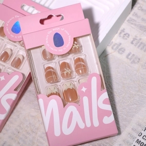 Cat eye press-on nails with white bow detail in professional retail packaging