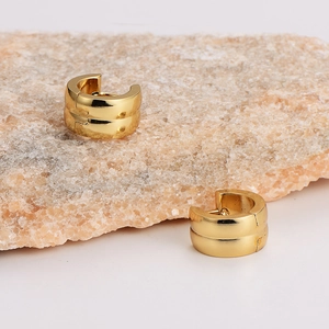 Elegant gold-tone stainless steel hoop earrings on natural stone for men and women
