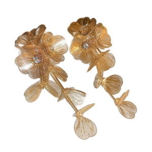 Elegant gold flower tassel earrings with sparkling crystals and intricate hollow metalwork