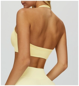 Rear view of lemon yellow halter yoga bra with crisscross open back design