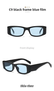 Detail view of retro square black frame sunglasses with transparent blue lenses