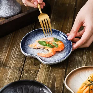 Japanese style ceramic snack plate with deep blue kiln transformation glaze and snow texture