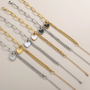 Detail showing titanium steel heart pendant necklaces in gold and silver finishes