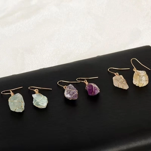 Natural raw crystal drop earrings with wire-wrapped green, purple, and yellow stones