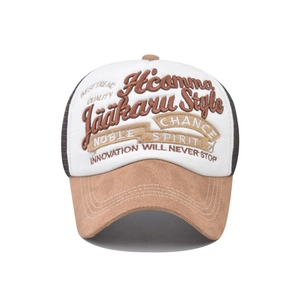 Close-up of 3D embroidery and breathable mesh detail on a vintage two-tone trucker cap