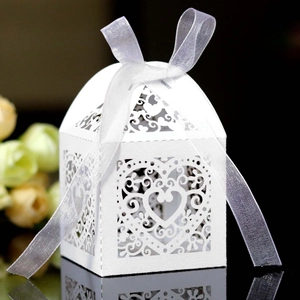 Laser cut white heart candy box with organza ribbon for wedding favors and gift packaging