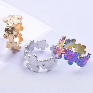 Floral stainless steel rings set in gold, silver and colorful finishes with open band
