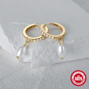 Elegant gold S925 sterling silver pearl earrings with zircon stones on a stone base