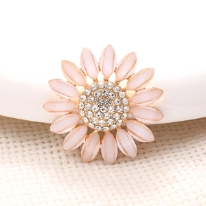Pink daisy jewelry charm with translucent petals and centered white rhinestones
