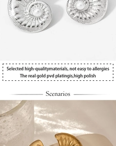 Macro detail of high-polish PVD gold shell earrings with elegant inlaid pearls