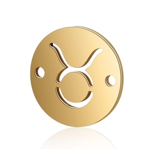 Macro view of gold stainless steel Taurus zodiac charm with hollow design and dual connectors