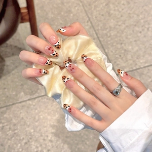 Handmade leopard print French almond press-on nails with 3D bow and gradient design