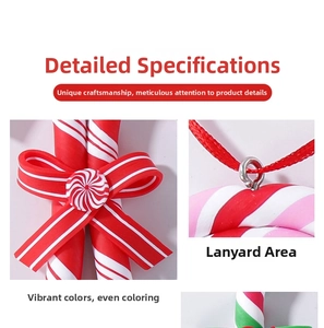 Detail of colorful polymer clay candy cane ornaments with bows and metal hanging loops