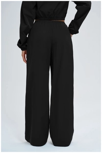 Rear view of loose-fit women sun-protective wide-leg sports pants with elastic high waist