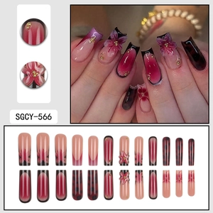 Deep red and pink gradient press-on nails with 3D flower embossing and gold beads