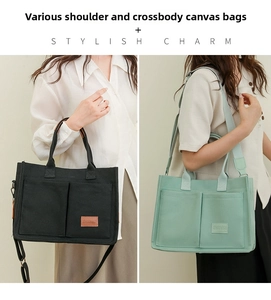 Detail of canvas tote bags in black and light green with shoulder straps and front pockets