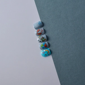 Detailed view of 5D embossed nail stickers with rainbow clouds and red hearts design