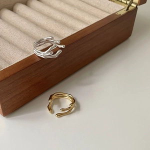 925 sterling silver irregular lava rings in gold and silver finish on a wooden box