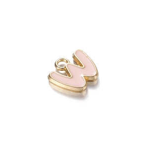 Detail of pink enamel letter W charm with golden alloy frame and top hanging loop