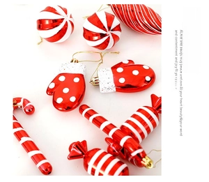 Detail of red and white striped candy and glove ornaments with golden hanging strings