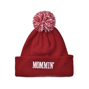 Detailed view of dark red knit beanie with MOMMIN embroidery and mixed color fluffy pompom