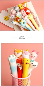 Detail showing various squishy cartoon animal pens in a basket and pen holder