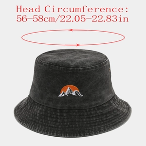 Detail of washed denim bucket hat with sun and mountain embroidery, size 56-58cm