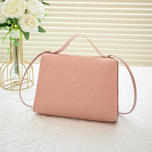 Pink woven texture small square crossbody bag with handle and metal lock detail