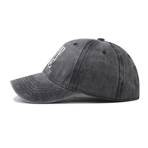 Side view of washed cotton baseball cap showing vintage texture and curved brim detail