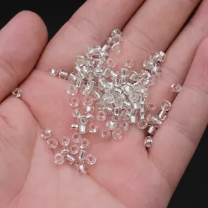 Silver lined glass seed beads for DIY jewelry making displayed in a hand palm